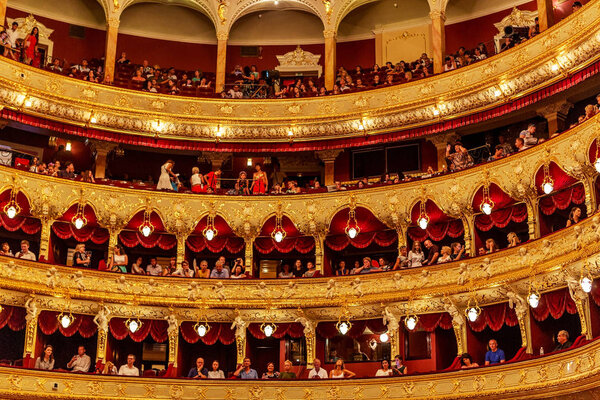 ODESSA, UKRAINE - July 16, 2016: Ukrainian singer Jamala at solo concert at  Opera House. Satisfied with  fans in hall. Spectators at  concert during  creative light and music show fashionable jazz orchestra