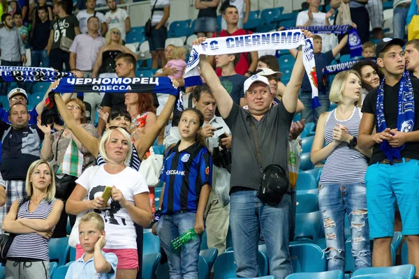 ODESSA, UKRAINE - August 2, 2015: The soccer fans and spectators in the stands of the stadium sick during futobolnogo match Dynamo Kiev - Chernomorets Odessa