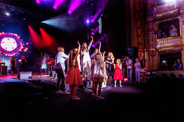 ODESSA, UKRAINE - July 16, 2016: Ukrainian singer Jamala at solo concert at  Opera House. Satisfied with  fans in hall. Spectators at  concert during  creative light and music show fashionable jazz orchestra