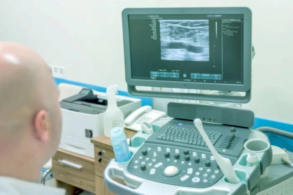 Unsharp medical background of ultrasound examination room. Without focus medical background of the ultrasound apparatus in the medical office for examining patients. Ultrasound diagnosis of diseases