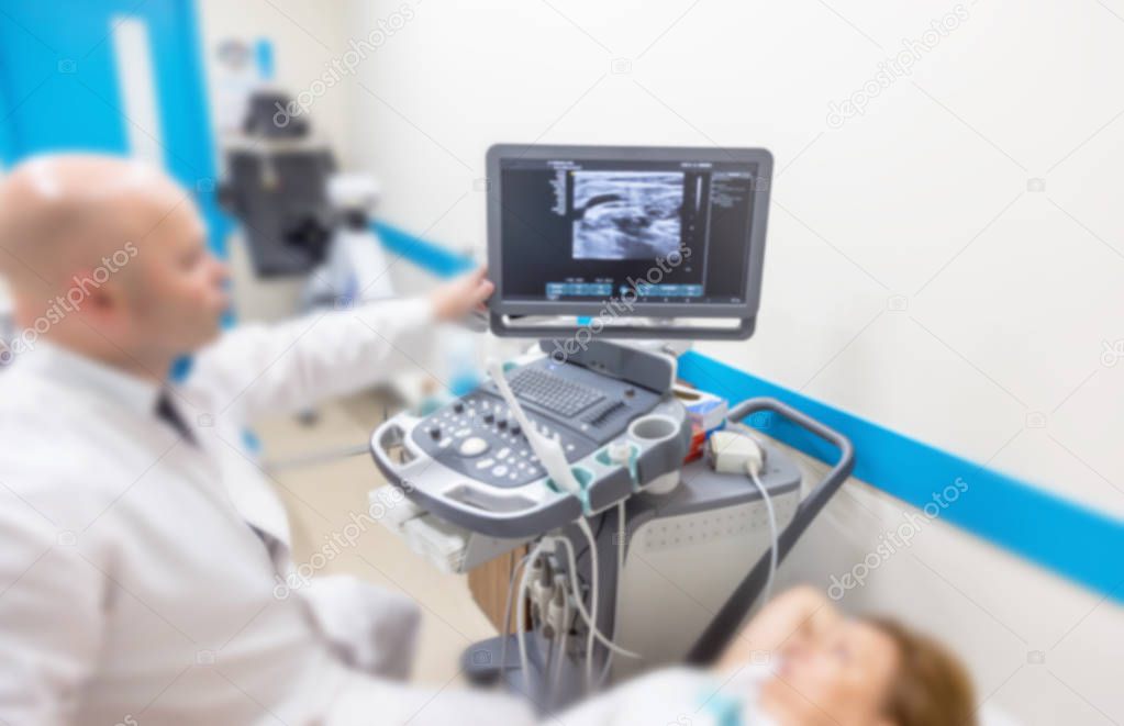 Unsharp medical background of ultrasound examination room. Without focus medical background of the ultrasound apparatus in the medical office for examining patients. Ultrasound diagnosis of diseases