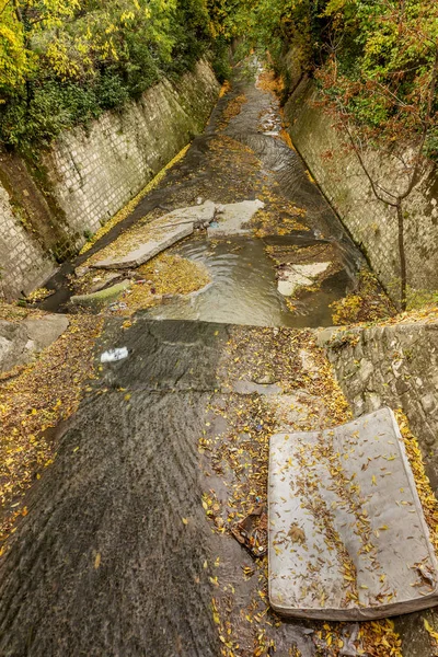 Varna, Bulgaria - 2015: Dirty waste water and household waste are merged into the open sea at the beach. Wastewater treatment plants. The environmental problem of environmental pollution.