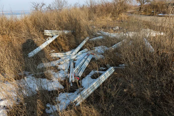 Ecological problem, disaster. Criminal disposal of fluorescent mercury lamps, E-waste. Environmental pollution. Ecological crime. Dirty broken fluorescent lamps, old fluorescent lamp dangerous rubbish