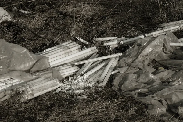 Ecological problem, disaster. Criminal disposal of fluorescent mercury lamps, E-waste. Environmental pollution. Ecological crime. Dirty broken fluorescent lamps, old fluorescent lamp dangerous rubbish