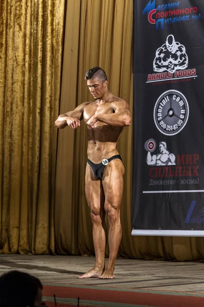 Odessa, Ukraine - October 12: Competitions Ukrainian bodybuilding bodybuilding athleticism of men and women by category on the stage, Ukraine October 12, 2014.