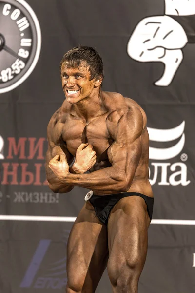 Odessa, Ukraine - October 12: Competitions Ukrainian bodybuilding bodybuilding athleticism of men and women by category on the stage, Ukraine October 12, 2014.