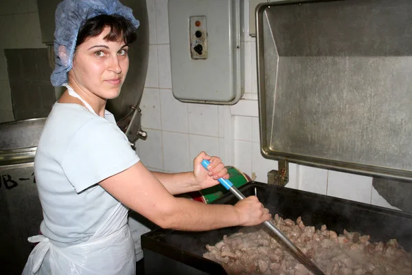 Odessa, Ukraine - July 7, 2007: The factory for the production of food from natural Ingredients. Food Convenience food. Production of dumplings, pancakes. Preparation of filling. Motion Blur.