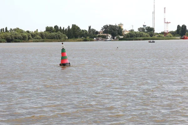 Navigation buoy of the river fairway at the mouth of the Danube River. Navigation buoy along the fairway of the river indicates the path for the passage of ships
