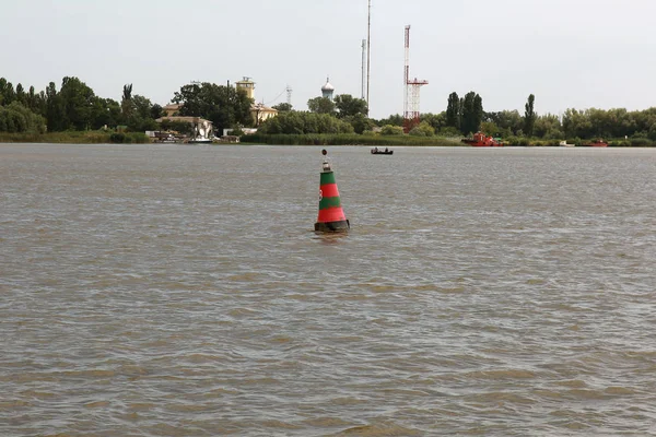 Navigation buoy of the river fairway at the mouth of the Danube River. Navigation buoy along the fairway of the river indicates the path for the passage of ships