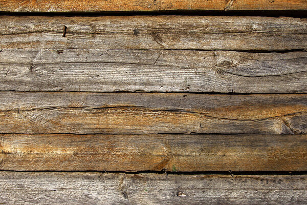 Structured Abstract texture of old wood. Rods and old weathered wood planks assembled in a flat background for creative design