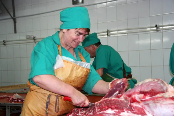 Odessa, Ukraine - July 7, 2007: The factory for the production of food from natural Ingredients. Food Convenience food. Production of dumplings, pancakes. Butcher shop. Butchering beef. Motion Blur.