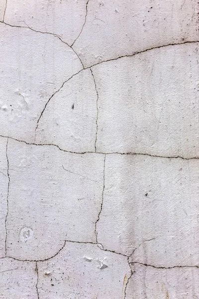 Güzel eski duvar büyük çatlaklar ve doku ile. Arka plan olarak kullanılabilir