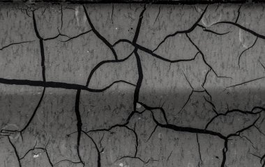Arka plan eski boya kırık. Yüzeyi büyük çatlaklar. Katmanları kapatın; birçok boya ve kağıt katmanları soyut bir doku vermek; arka plan makro peeling boyalı yüzey oluşturur