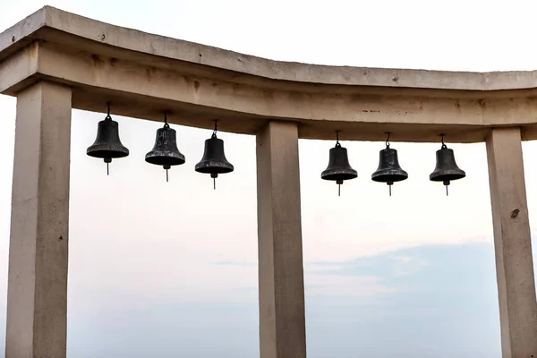 Close Number Ancient Bronze Bells Triumphal Arch Backlit Silhouettes Background — Stock Photo, Image