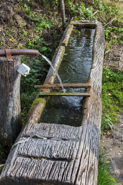 Traditional wooden trough - troughs for animals and humans, the concentration of pure water from mountain springs. Ancient peasant household technology