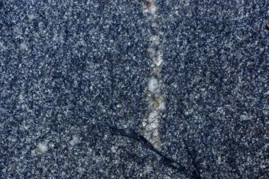 Granit doku arka plan için. Doğal granit yüzey deseni arka plan olarak. Taş duvar doğal granit, soyut yüzey çakıl kaya arka plan ile. Doğal taş mimari dekorasyon için siyah ve gri noktalar ile tedavi.