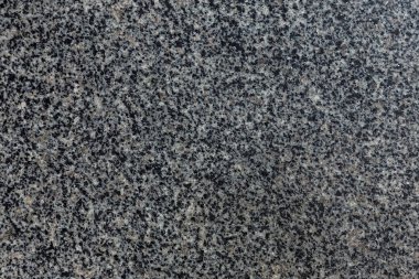 Granit doku arka plan için. Doğal granit yüzey deseni arka plan olarak. Taş duvar doğal granit, soyut yüzey çakıl kaya arka plan ile. Doğal taş mimari dekorasyon için siyah ve gri noktalar ile tedavi.