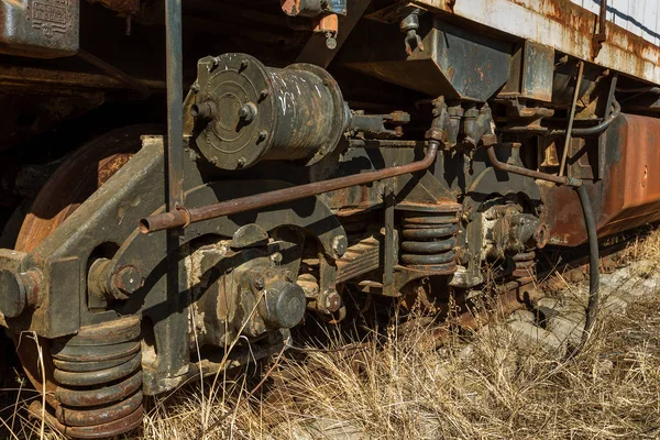 Old rusty train locomotive thrown into exclusion zone of Chernobyl. Zone of high radioactivity. Ghost town of Pripyat. Chernobyl disaster. Rusty abandoned Soviet machinery in area of nuclear accident at plant