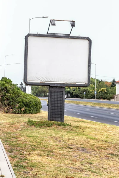 Blank billboard on the city street. The blank background for placing advertising posters