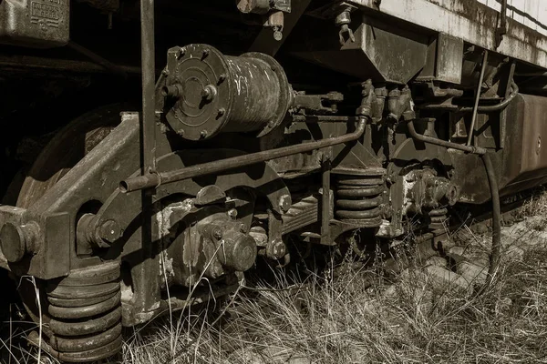 Old rusty train locomotive thrown into exclusion zone of Chernobyl. Zone of high radioactivity. Ghost town of Pripyat. Chernobyl disaster. Rusty abandoned Soviet machinery in area of nuclear accident at plant