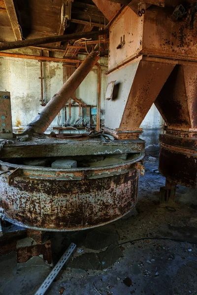 Old abandoned industrial building of cement plant Chernobyl. Ruins of an old factory. Rubbish, rusty metal is broken equipment of cement plant. Element for apocalyptic design, retro, stalker