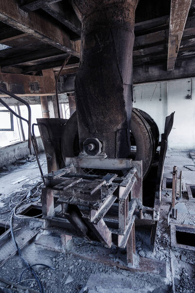 Old abandoned industrial building of cement plant Chernobyl. Ruins of an old factory. Rubbish, rusty metal is broken equipment of cement plant. Element for apocalyptic design, retro, stalker