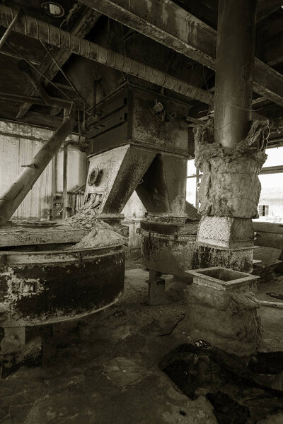 Old abandoned industrial building of cement plant Chernobyl. Ruins of an old factory. Rubbish, rusty metal is broken equipment of cement plant. Element for apocalyptic design, retro, stalker