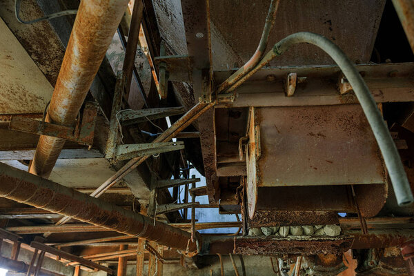 Old abandoned industrial building of cement plant Chernobyl. Ruins of an old factory. Rubbish, rusty metal is broken equipment of cement plant. Element for apocalyptic design, retro, stalker
