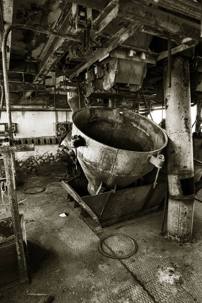 Old abandoned industrial building of cement plant Chernobyl. Ruins of an old factory. Rubbish, rusty metal is broken equipment of cement plant. Element for apocalyptic design, retro, stalker