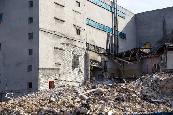 An abandoned house collapses in a poor neighborhood. The house is destroyed. Cracks in wall of house. Destruction of old houses, earthquakes, economic crisis, abandoned houses. Broken unfit house