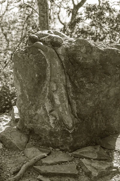 Mysterious ancient stone statues of idols at top of the Markot Range, Gelenzhik, Krasnodar Territory, Russia, 2018. rocky formation among green forest. Mysterious place looks like stone idol. Great place in wild forests