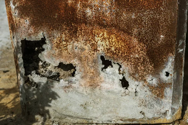 Corroded white metal background. Rusted white painted metal wall. Rusty metal background with streaks of rust. Rust stains. The metal surface rusted spots. Rysty corrosion