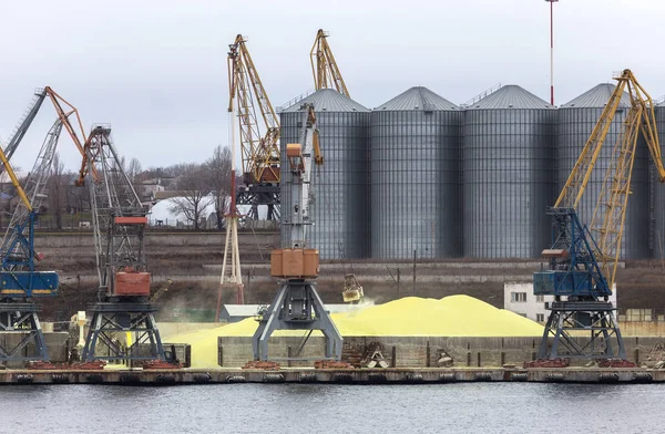 Industrial container cargo cargo ship with a working crane. Cargo container ship in the dock. Delivery of containers. Logistics import export and transport industry