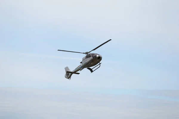 ODESSA, UKRAINE - June 4, 2013: Presentation of the private test light modern civil helicopter business class on a small private airport in the summer on a cloudy day