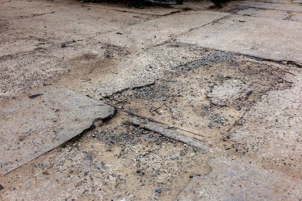 Concrete asphalt cracks on the road, Line rough surface and grey cracked asphalt road, Puddle Water on the Crack road, flooded and road