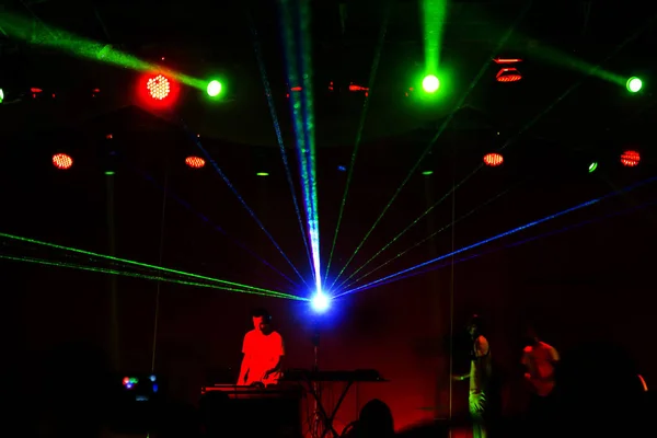 Lights show. Laser show. Nightclub dj parties use music, dancing sound with bright light. club night light dj party club. With car for smoke and lights. Creative Light show on open nightclub scene