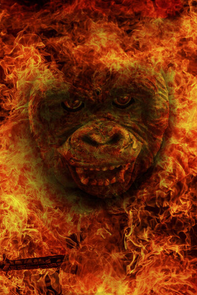 Abstract image of a huge ape in a flame of fire, the symbol of an angel of death. Conceptual blank for background illustration of scary stories and horror.