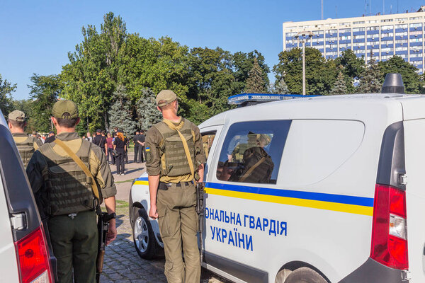 Odessa, Ukraine - August 01, 2018: Convoy of specialized police cars with police officers is assigned task, combat order before patrolling streets of city. Police specialized cars on parade ground