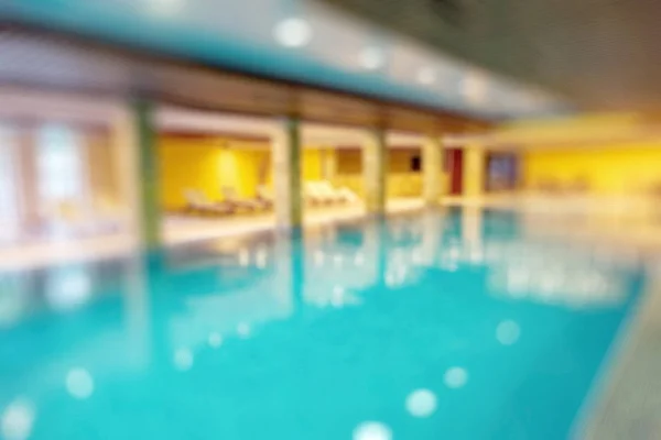 Swimming pool in a recreation area camping blurred background. Fuzzy interior basin with warm dark colors. As a basis for creative fashion design.