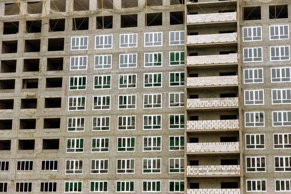 stock image Facade of new multi-apartment high-rise apartment building. Construction of new modern multi-apartment residential complexes Typical view of multi-storey block in one of the residential condominiums