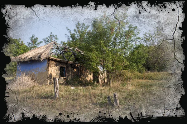 Ruined old house. Ruins of house made of shell rock, straw and clay in village. Poor old village. Old ruined country house. Dying deserted, abandoned dead villages during economic and political crisis