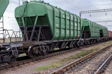 Odessa, Ukraine - September 28 2015: The movement of freight trains on the Ukrainian railways. railway interchange. Signs on the railway. Railway traffic lights. Change the way. clipart