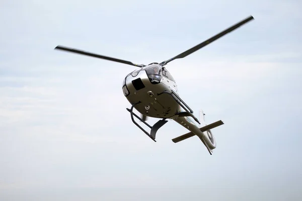 ODESSA, UKRAINE - June 4, 2013: Presentation of the private test light modern civil helicopter business class on a small private airport in the summer on a cloudy day