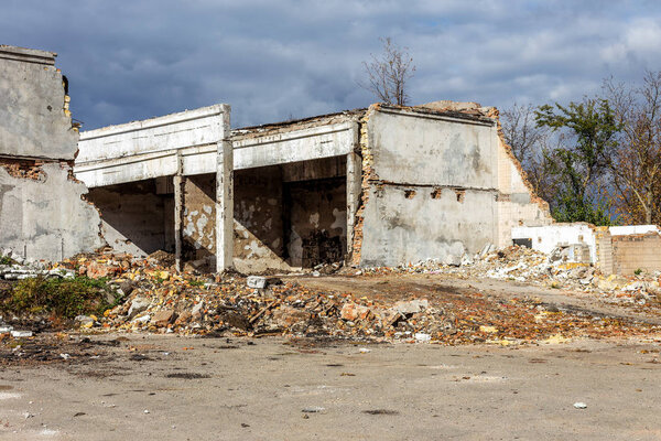 Landscape with the ruins of the old industrial factory buildings. The interior of an abandoned factory with rubble plunder and waste. The collapse of the Ukrainian economy. Odessa
