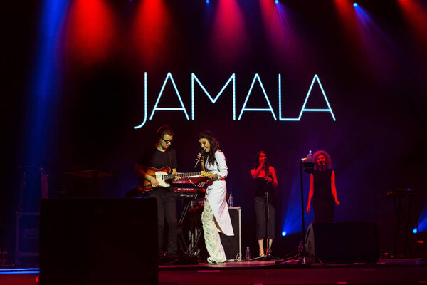 ODESSA, UKRAINE - July 16, 2016: Ukrainian singer Jamala at solo concert at Opera House. Delighted fans in hall. Jamal won 61st annual Eurovision Song Contest with song "1944" in Stockholm in 2016.