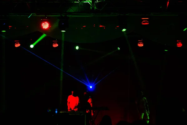 Lights show. Laser show. Nightclub dj parties use music, dancing sound with bright light. club night light dj party club. With car for smoke and lights. Creative Light show on open nightclub scene