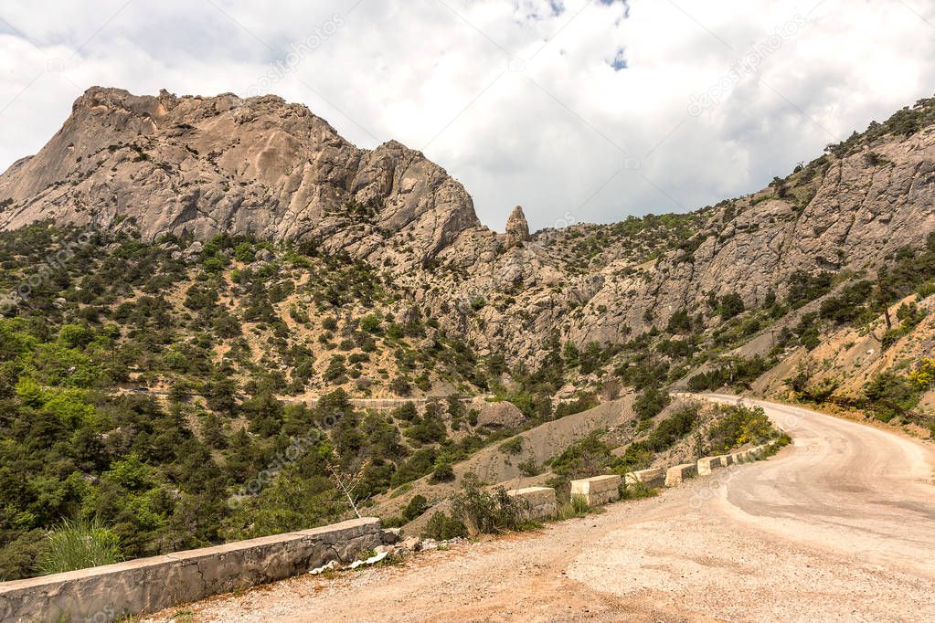 Good asphalted road along the picturesque rocky high mountains in Crimea.