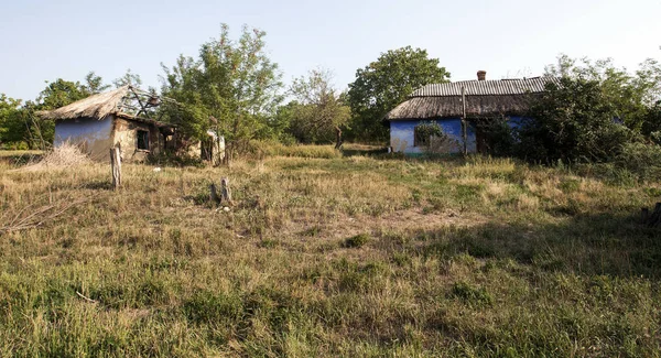 Ruined old house. Ruins of house made of shell rock, straw and clay in village. Poor old village. Old ruined country house. Dying deserted, abandoned dead villages during economic and political crisis