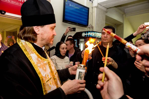 Odessa, Ukraine - April 11, 2015: Easter, parishioners of the Orthodox Church of the Holy Fire from Jerusalem at the feast of the Resurrection of Christ. Orthodox Easter