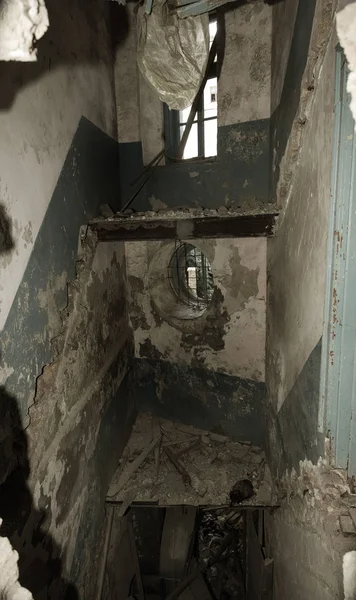 Mystical interior, ruins of an abandoned ruined building of an ancient 18th century building. Old ruined walls, corridor with garbage and mud. Destroyed molding, gypsum decorations, bas-relief